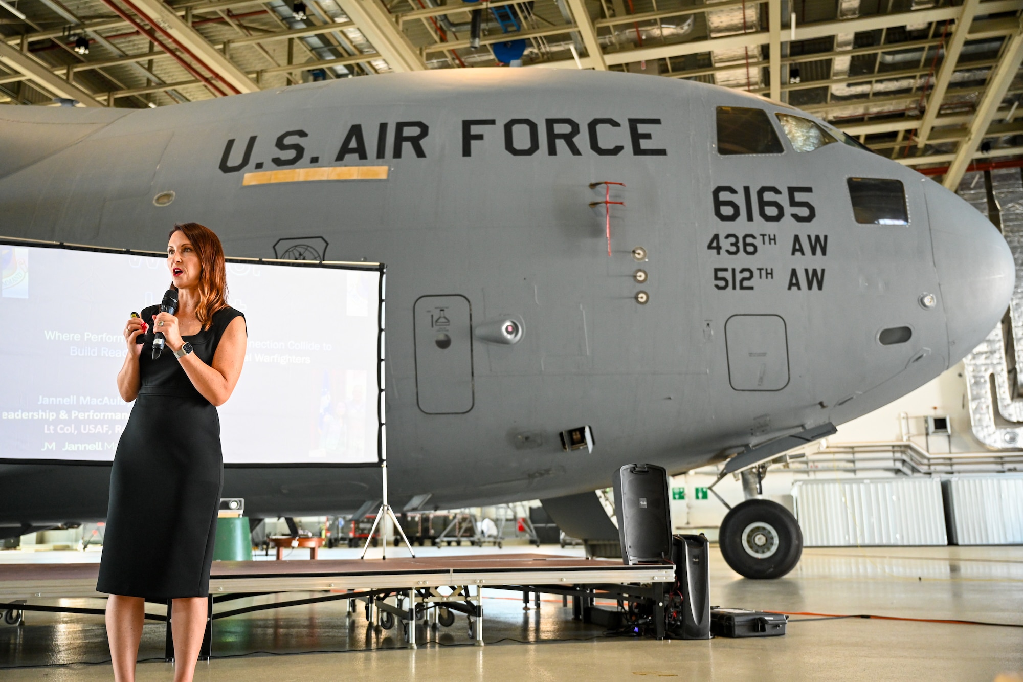 Dr. Jannell MacAulay, a strategic health and human performance specialist, gives a Warrior Heart keynote speech to Airmen assigned to the 521st Air Mobility Operations Wing, August 29, 2024, inside of Hangar 5 on Ramstein Air Base, Germany.