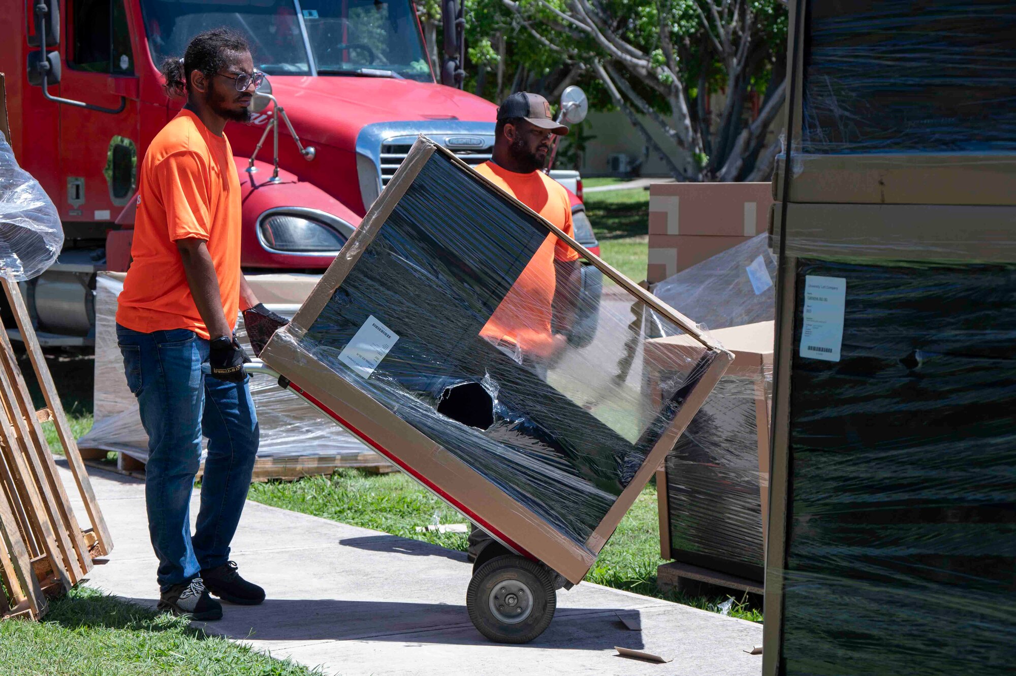 A photo of a dolly moving furniture.
