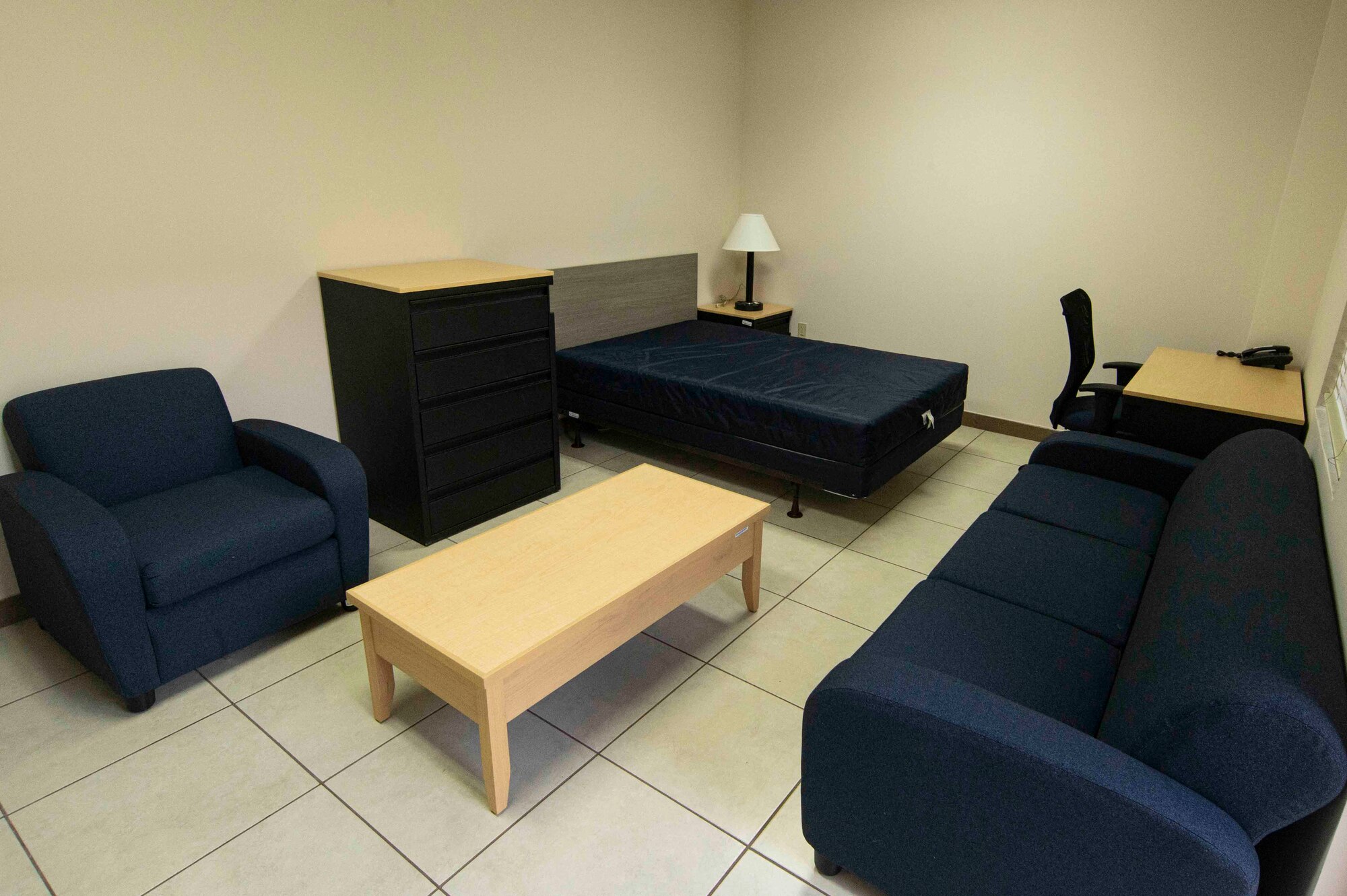 A photo of a room with furniture.