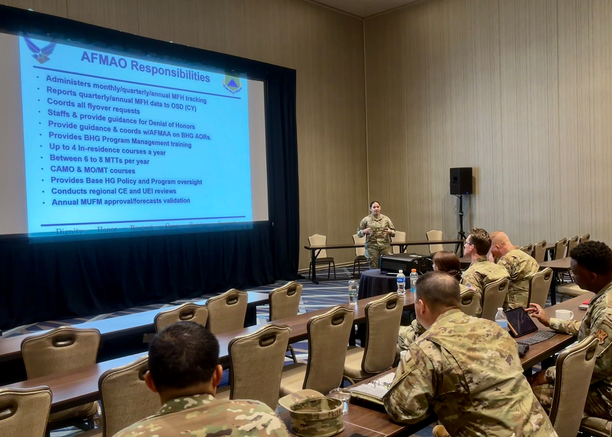 An Airman gives a brief to other Airmen.