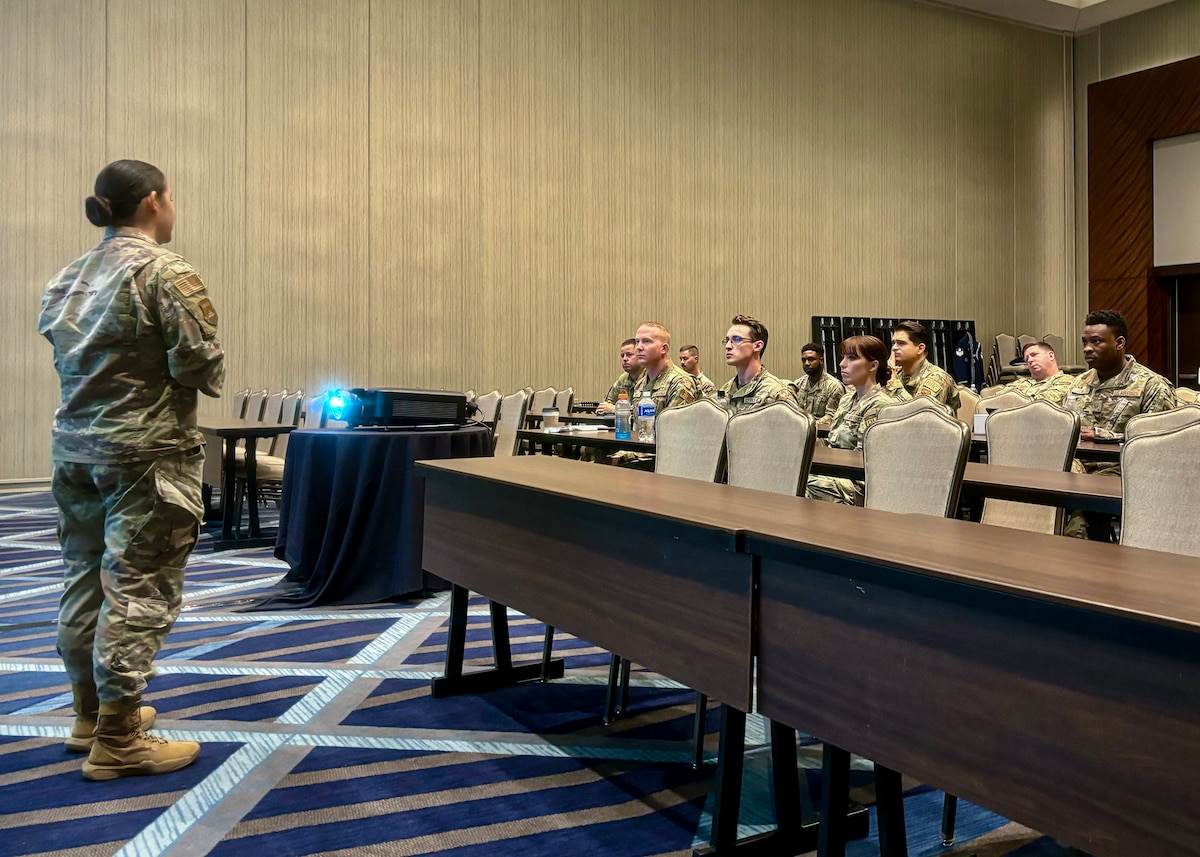 An Airman gives a brief to other Airmen.