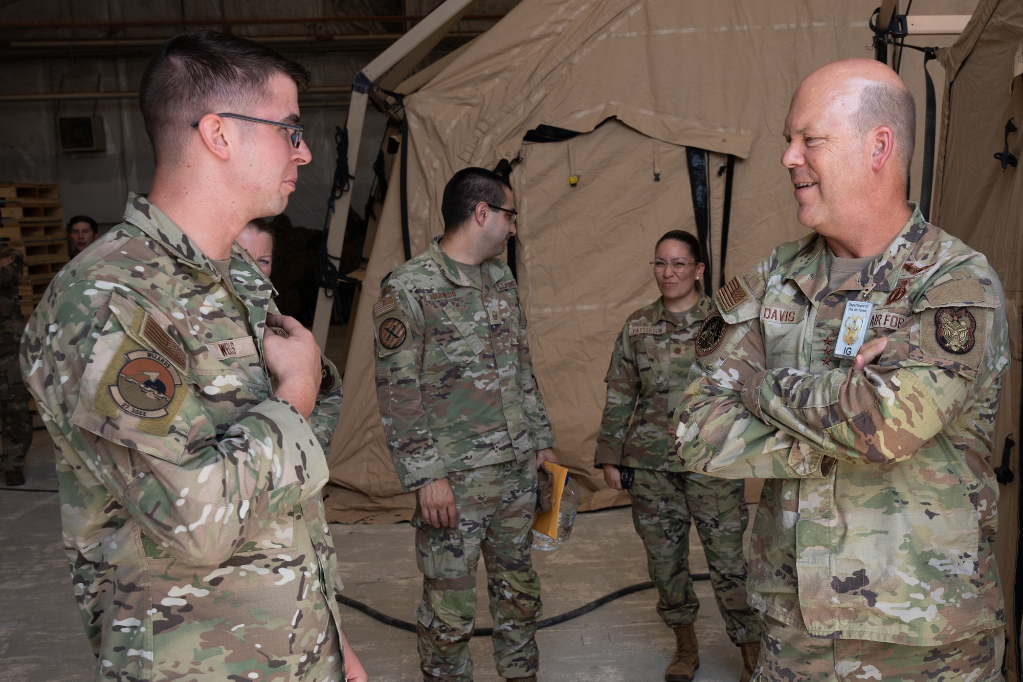 U.S. Air Force Staff Sgt. Laeth Wells, 27th Special Operations Support Squadron equipment custodian, speaks with U.S. Air Force Lt. Gen. Stephen Davis, Department of the Air Force Inspector General, Cannon Air Force Base, New Mexico, July 30, 2024. During his visit, Davis was shown some of the unconventional capabilities The Steadfast Line brings to the joint force’s collective agility, including the 27th SOW Mission Sustainment Team. (U.S. Air Force photo by Airman 1st Class Tori Shearn)