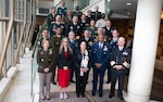 A group photo of multinational military personnel.