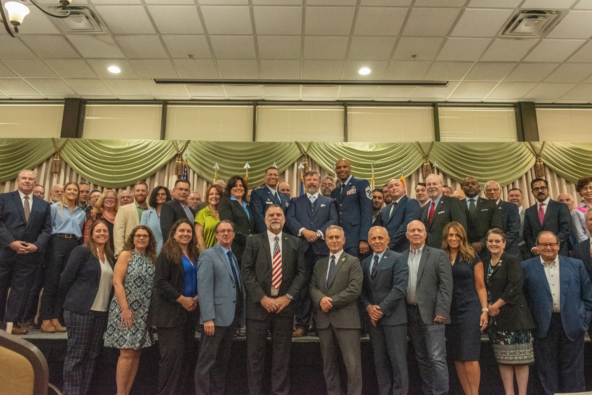 Honorary Commanders pose for a photo at the 2024 JB MDL Honorary Commander Induction Ceremony on Aug 2, 2024. The mission of the Honorary Commanders Program is twofold; one, to educate key community leaders about a unit’s mission and to foster a supportive relationship with the community, increase military involvement in civic endeavors and organizations and make members of the local community feel part of the unit. (U.S. Air Force by Jiahao-Jerry Lai)