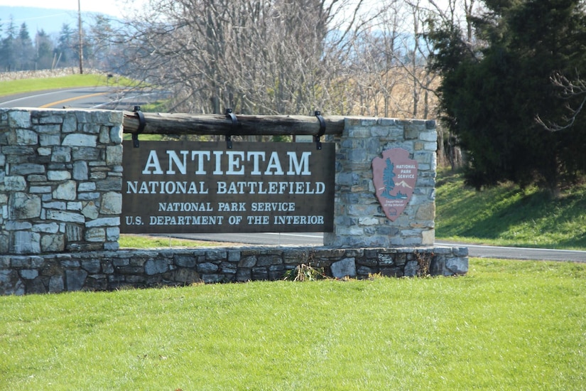 A National Park Service sign highlights the entrance to Antietam National Battlefield.