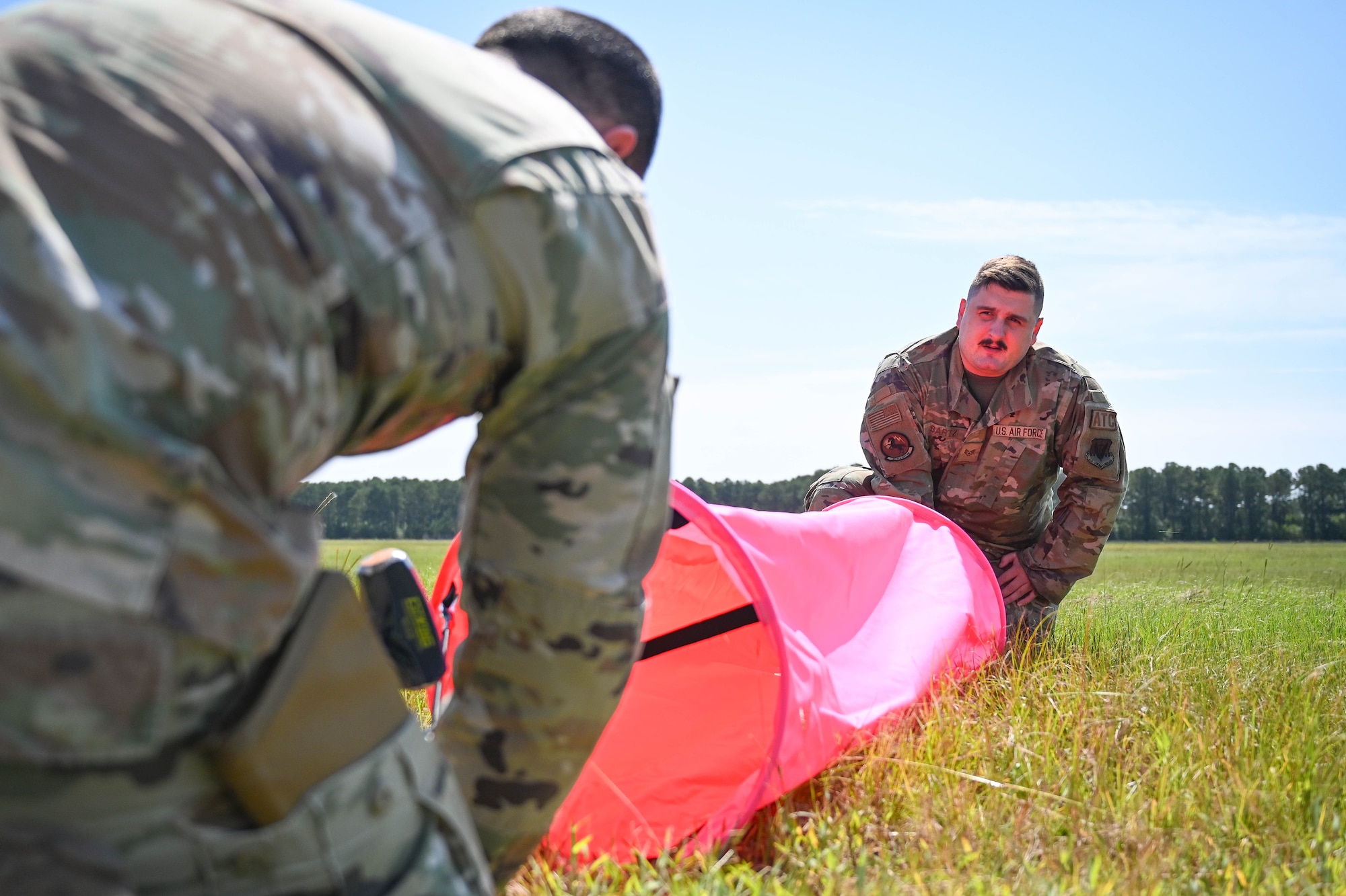 Airmen install marker panels on the flight line.