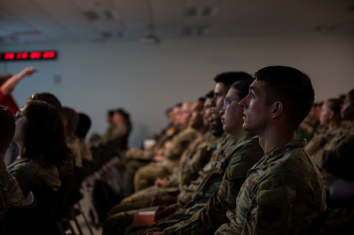 U.S. Airmen attend a pre-deployment brief during Exercise Mosaic Lightning 24-02 at Davis-Monthan Air Force Base, Arizona, Aug. 23, 2024. Airmen were given a 24-hour notice to prepare for a simulated deployment. (U.S. Air Force photo by Airman 1st Class Jasmyne Bridgers-Matos)