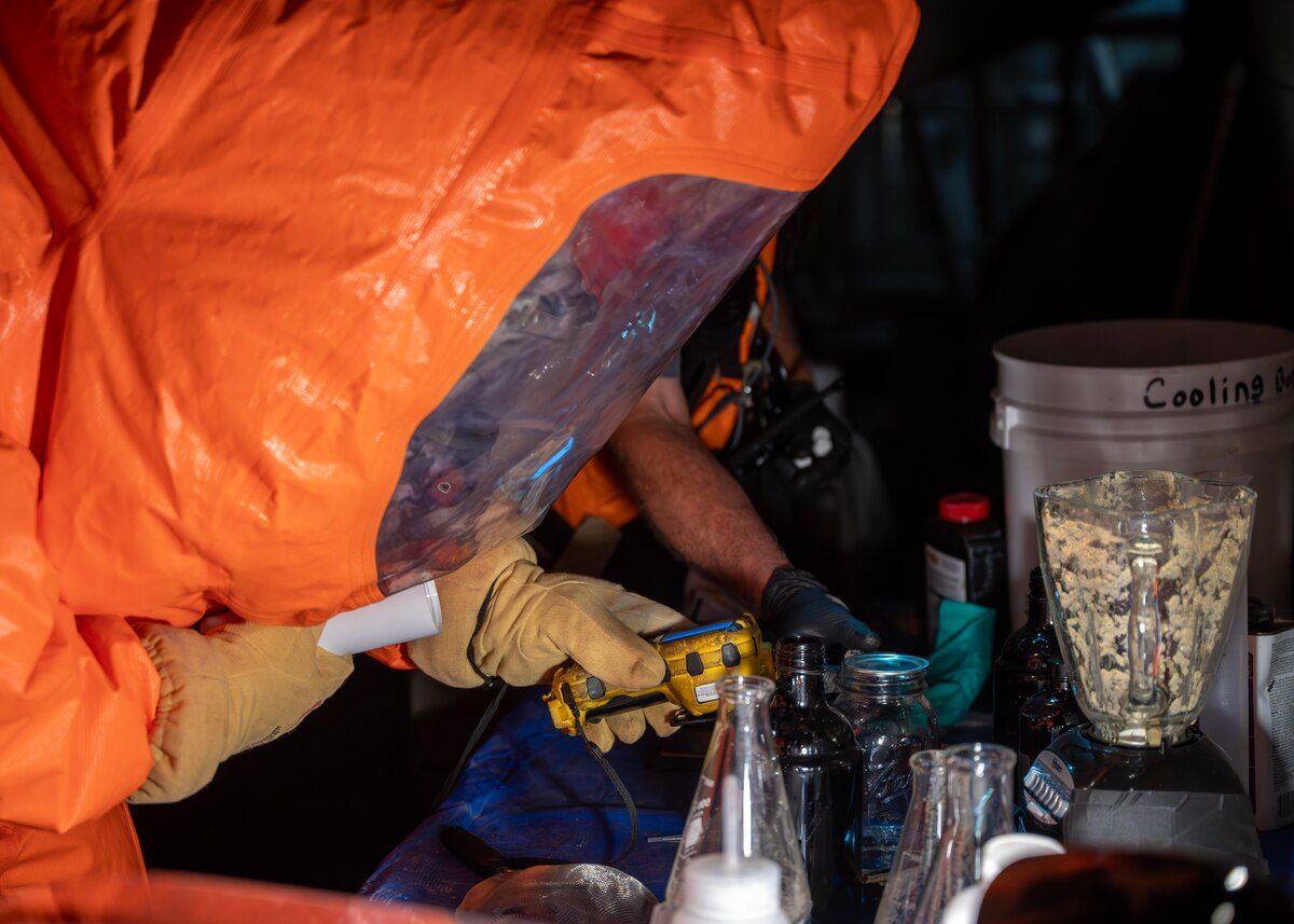 Zachary Kirkish, 17th Civil Engineer Squadron firefighter, identifies hazardous material at the Spur Arena, San Angelo, Texas, Aug. 27, 2024. The 17th Civil Engineer Squadron swiftly identified the simulated hazardous material, which could be chemical, biological, radiological, or nuclear.  (U.S. Air Force photo by Senior Airman Sarah Williams)