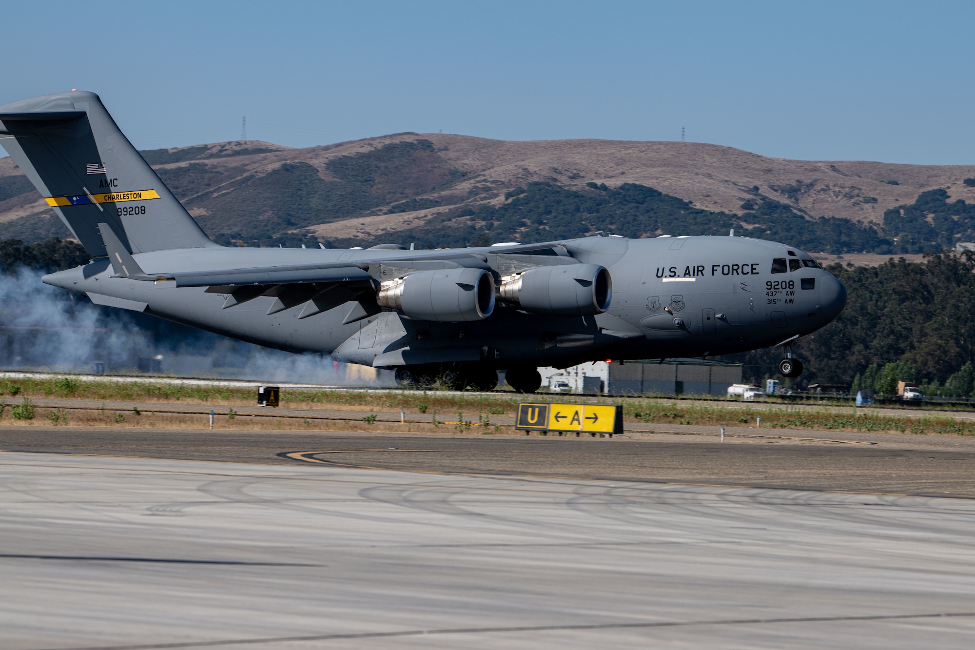 A U.S. Air Force C-17 Globemaster III lands on the runway during Agile Flag 24-3 at Santa Maria, California, Aug. 2, 2024. AGILE FLAG 24-3 is an Air Combat Command certification exercise that tested the 23rd Wing’s ability to generate combat air power while continuing to move, maneuver, and sustain wing and subordinate force elements in a dynamic and contested environment. (U.S. Air Force photo by 2nd Lt. Benjamin Williams)
