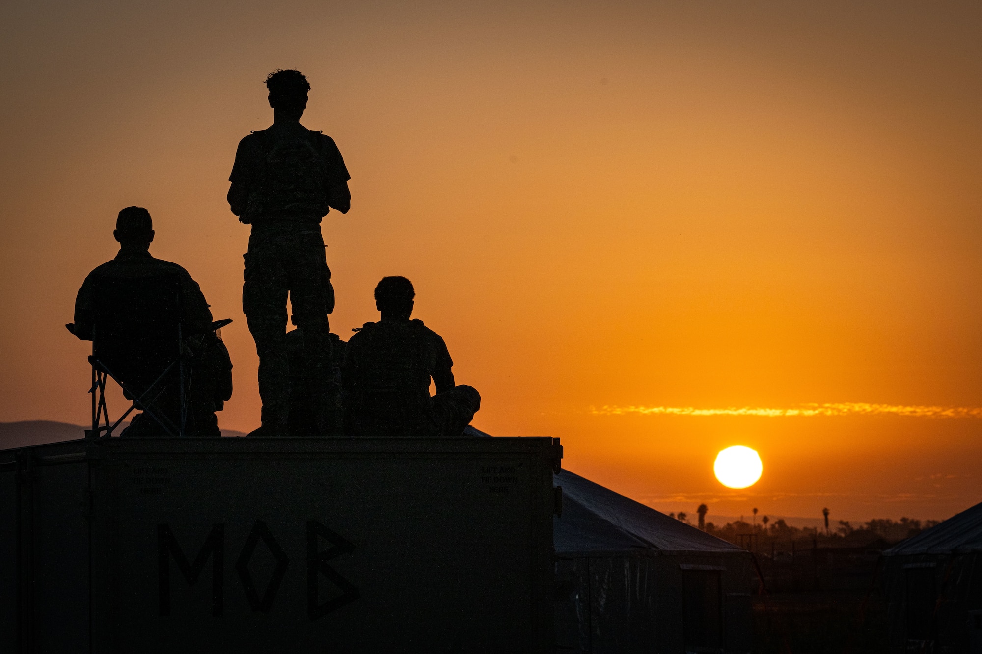 U.S. Air Force Airmen assigned to the 23rd Air Expeditionary Wing pose for a photo during Exercise Agile Flag 24-3 at Santa Maria, Aug. 3, 2024. During AGILE FLAG 24-3, the 23rd Wing provided the Air Expeditionary Wing leadership element, the Command-and-Control Force Element, and the Airbase Squadron at two separate locations exercising rapid insertion into theaters, establishing logistics and communications with theater C2, receipt of follow-on forces, mission generation, and combat power projection across all domains, while making critical decisions needed to remain agile. (U.S. Air Force photo by 2nd Lt. Benjamin Williams)