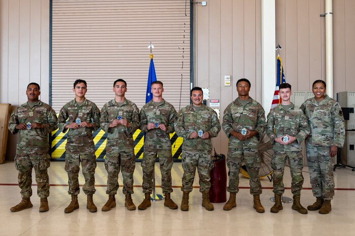 Seven Airmen and Chief Master Sgt. Warren posing for a group photo