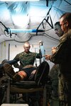 U.S. Sailors with Combat Logistics Battalion 5 (Reinforced), Marine Rotational Force – Darwin 24.3, discuss methods of surgery during a mass casualty exercise during Exercise Bhakti Kanyini AUSINDO 24 at Robertson Barracks, NT, Australia, Aug. 20, 2024.