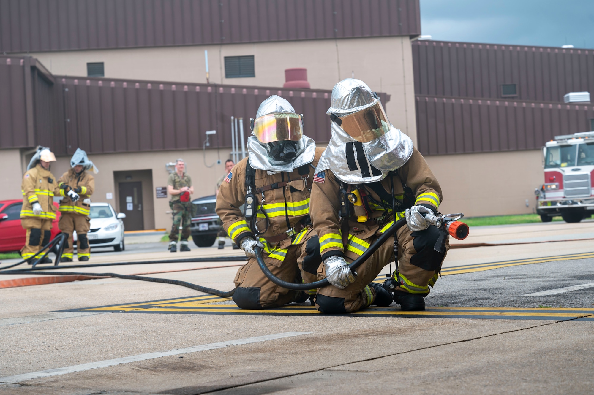 U.S. Air Force Airmen assigned to the 51st Civil Engineer Squadron extinguish a simulated fire during Ulchi Freedom Shield 24 at Osan Air Base, Republic of Korea, Aug. 22, 2024. As the most forward deployed, permanently based wing in the USAF, the 51st Fighter Wing is charged with providing mission-ready Airmen to execute combat operations and receive follow-on forces. Routine training is essential for 51st Fighter Wing Airmen to refine their warfighting proficiencies through practical application, concurrently enhancing their ability to respond skillfully to contingencies. (U.S. Air Force photo by Senior Airman Frazier)