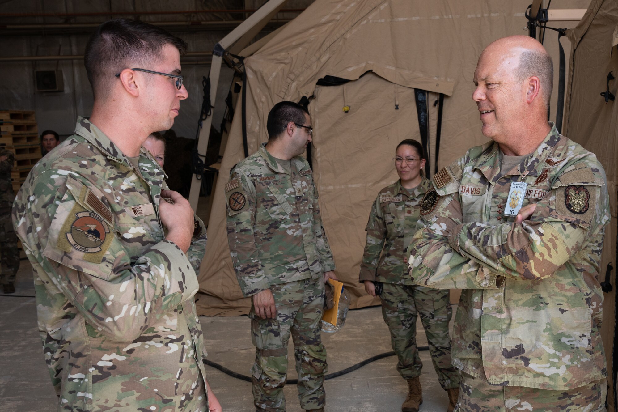 U.S. Air Force Staff Sgt. Laeth Wells, 27th Special Operations Support Squadron equipment custodian, speaks with U.S. Air Force Lt. Gen. Stephen Davis, Department of the Air Force Inspector General, Cannon Air Force Base, New Mexico, July 30, 2024. During his visit, Davis was shown some of the unconventional capabilities The Steadfast Line brings to the joint force’s collective agility, including the 27th SOW Mission Sustainment Team. (U.S. Air Force photo by Airman 1st Class Tori Shearn)