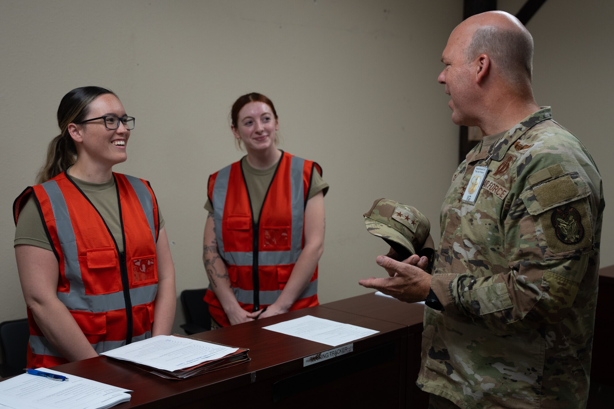 U.S. Air Force Senior Airman Brittni Aaron, 27th Special Operations Force Support Squadron relocations supervisor, and U.S. Air Force Airman 1st Class Audrey Figueroa, 27th SOFSS customer support technician, speak with U.S. Air Force Lt. Gen. Stephen Davis, Department of the Air Force Inspector General, Cannon Air Force Base, New Mexico, July 30, 2024. Davis is responsible for three field operating agencies: the Air Force Inspection Agency, the Air Force Office of Special Investigations and the Department of Defense Cyber Crime Center. (U.S. Air Force photo by Airman 1st Class Tori Shearn)