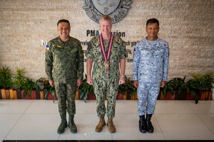 Adm. Samuel J. Paparo, center, commander of U.S. Indo-Pacific Command, joins Gen. Romeo S. Brawner Jr., left, Chief of Staff of the Armed Forces of the Philippines, and Rear Adm. Caesar Valencia, superintendent of the Philippine Military Academy, for a group photo during an overseas trip, Aug. 29, 2024.