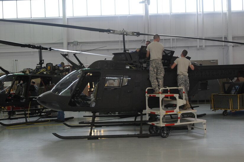 Soldiers with Charlie Company, 1st Battalion, 376th Aviation work to repair a OH-58 helicopter at the Army Aviation Support Facility in Frankfort, Ky., Sept. 18, 2012.