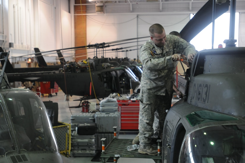 A soldier with Charlie Company, 1st Battalion, 376th Aviation works to repair a OH-58 helicopter at the Army Aviation Support Facility in Frankfort, Ky., Sept. 18, 2012. The Kentucky Guard has become the maintenance hub for OH-58 repairs for all of the National Guard.