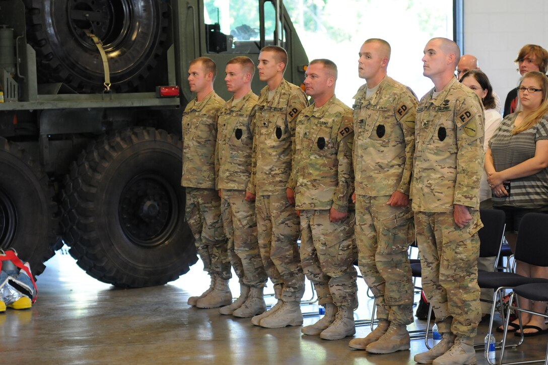 Six of the seven member 176th Engineer Firefighting Team stand at attention during the unit's welcome home ceremony in Greenville, Ky., Sept. 11, 2012. The small unit was responsible for fire-fighting duties on airfields and forward operating bases in Afghanistan.