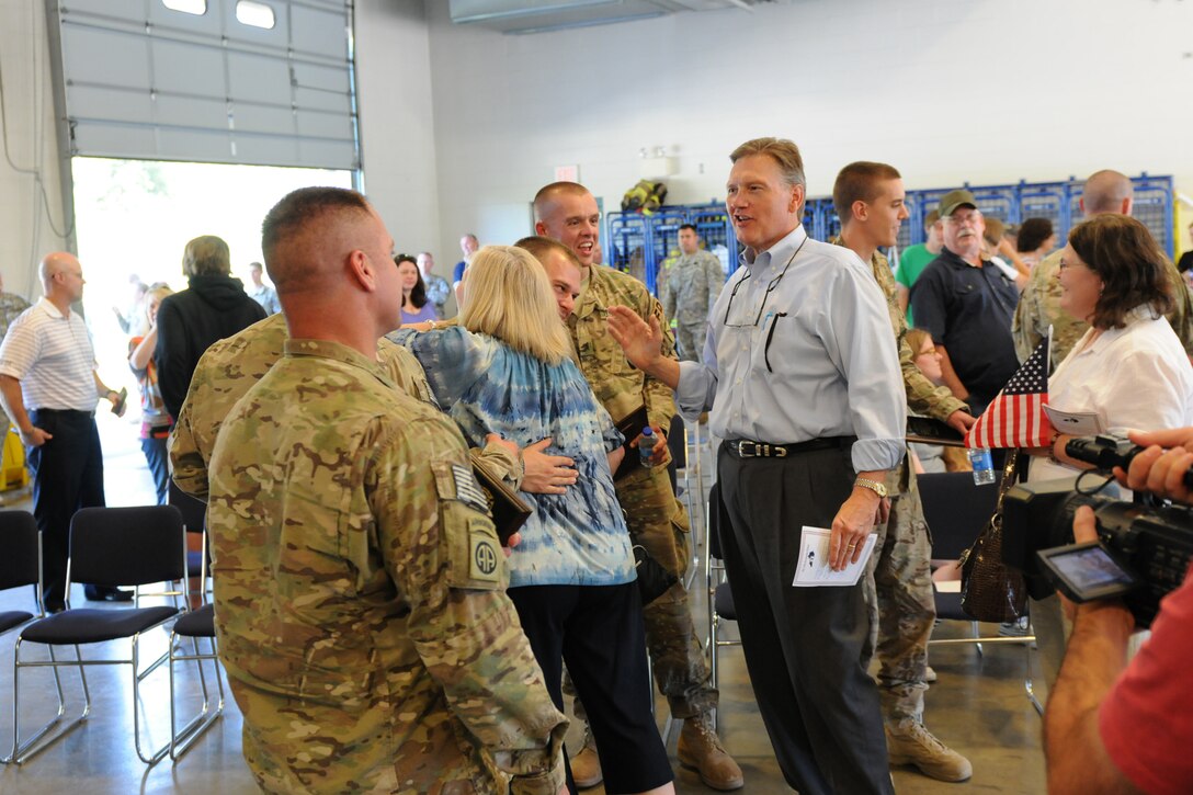 Friends and family members greet the soldiers of the 176th Engineer Firefighting Team following the unit's welcome home ceremony in Greenville, Ky., Sept. 11, 2012. The unit was welcomed by local citizens who lined the streets of Greenville during the unit's travel to the Wendell H. Ford Regional Training Center.