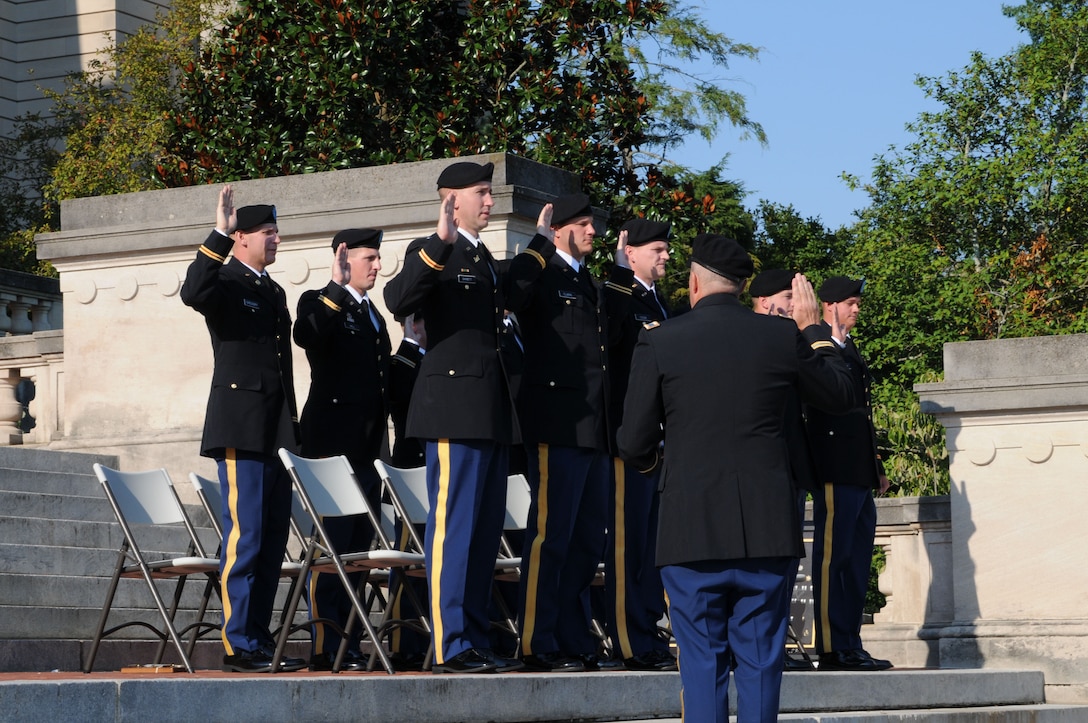 Col. William A. Denny, Commander for the 238th Regiment, administers the oath of office to OCS class 54-12 during the Officer Commissioning Ceremony at the Kentucky State Capitol in Frankfort, Ky., Aug 25. The 238th Regiment graduated 11 new officers to serve in the Kentucky National Guard.