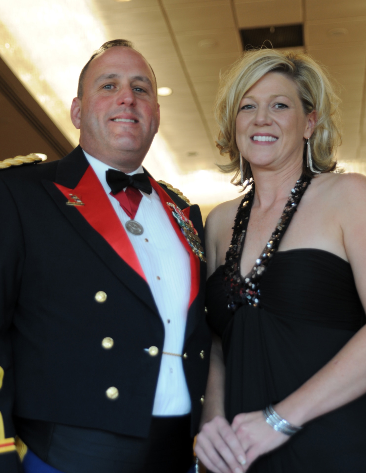 Lt. Col. Tony Sims, 1st Battalion, 238th Regiment commander, accompanied by Tara Koontz, attend the military ball in honor of the recent Officers Candidate School graduates at the Capital Plaza Hotel in Frankfort, Ky., Aug. 25, 2012.