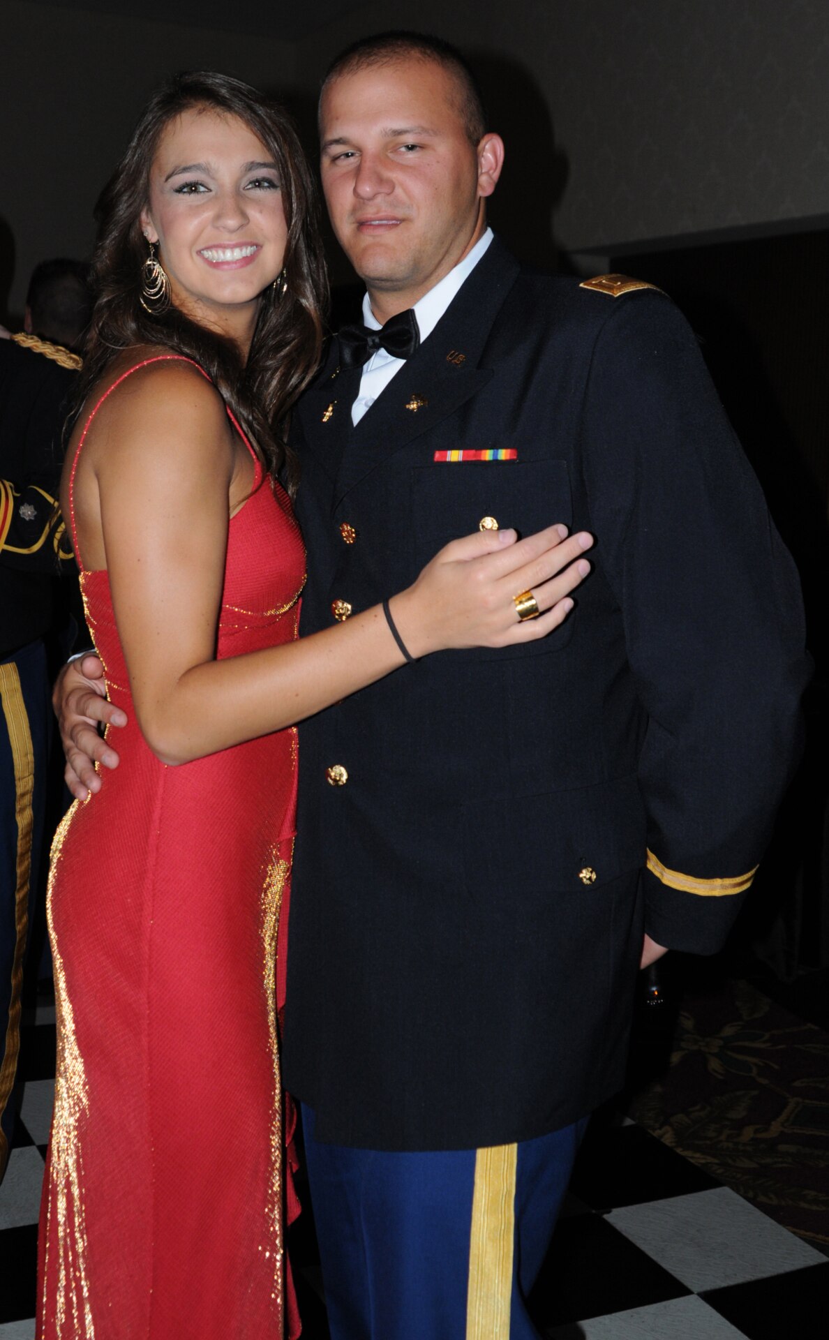 Newly commissioned 2nd Lt. Brian Clark, along with his date, enjoy the festivities at the military ball held in honor of the recent Officer Candidate School graduates at the Capital Plaza Hotel in Frankfort, Ky., Aug. 25, 2012.