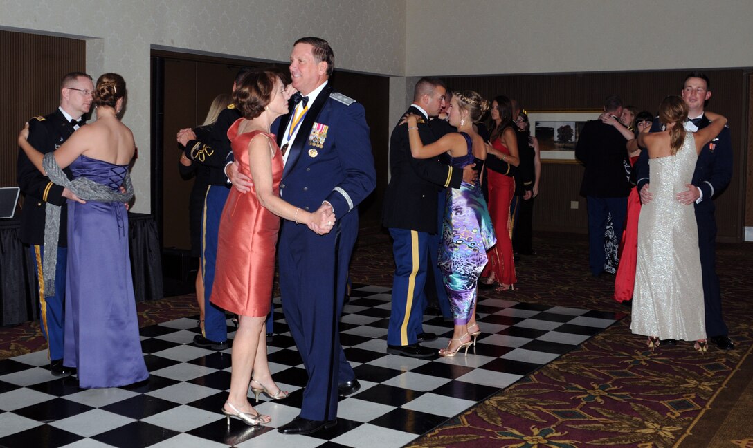 Maj. Gen. Edward Tonini, adjutant general of Kentucky, dances alongside recent graduates of Officer Candidate School Class 54-12 at the military ball held in their honor at the Capital Plaza Hotel in Frankfort, Ky., Aug. 25, 2012. Tonini was the key note speaker at their graduation.