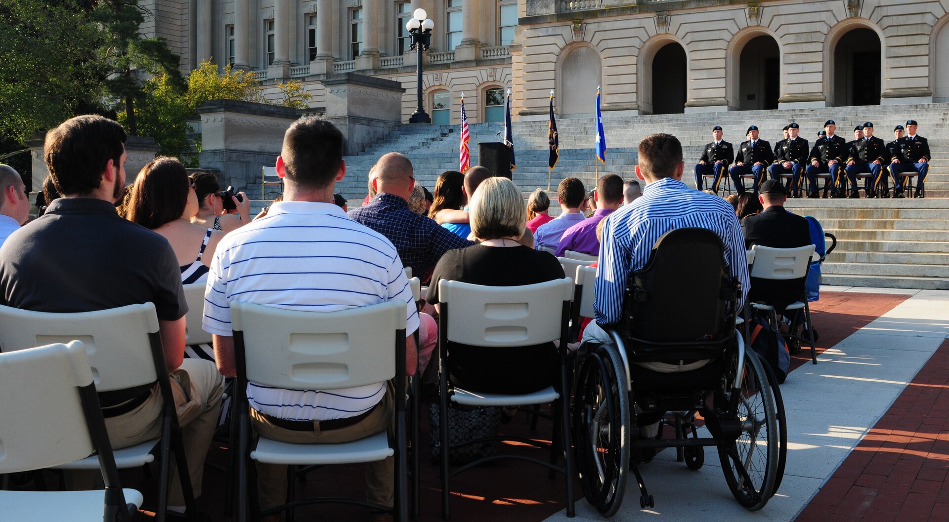 Attendees watch as Class 54-12 of Kentucky's Officer Candidate School become new second lieutenants as part of their graduation at the State Capitol in Frankfort, Ky., Aug. 25, 2012.