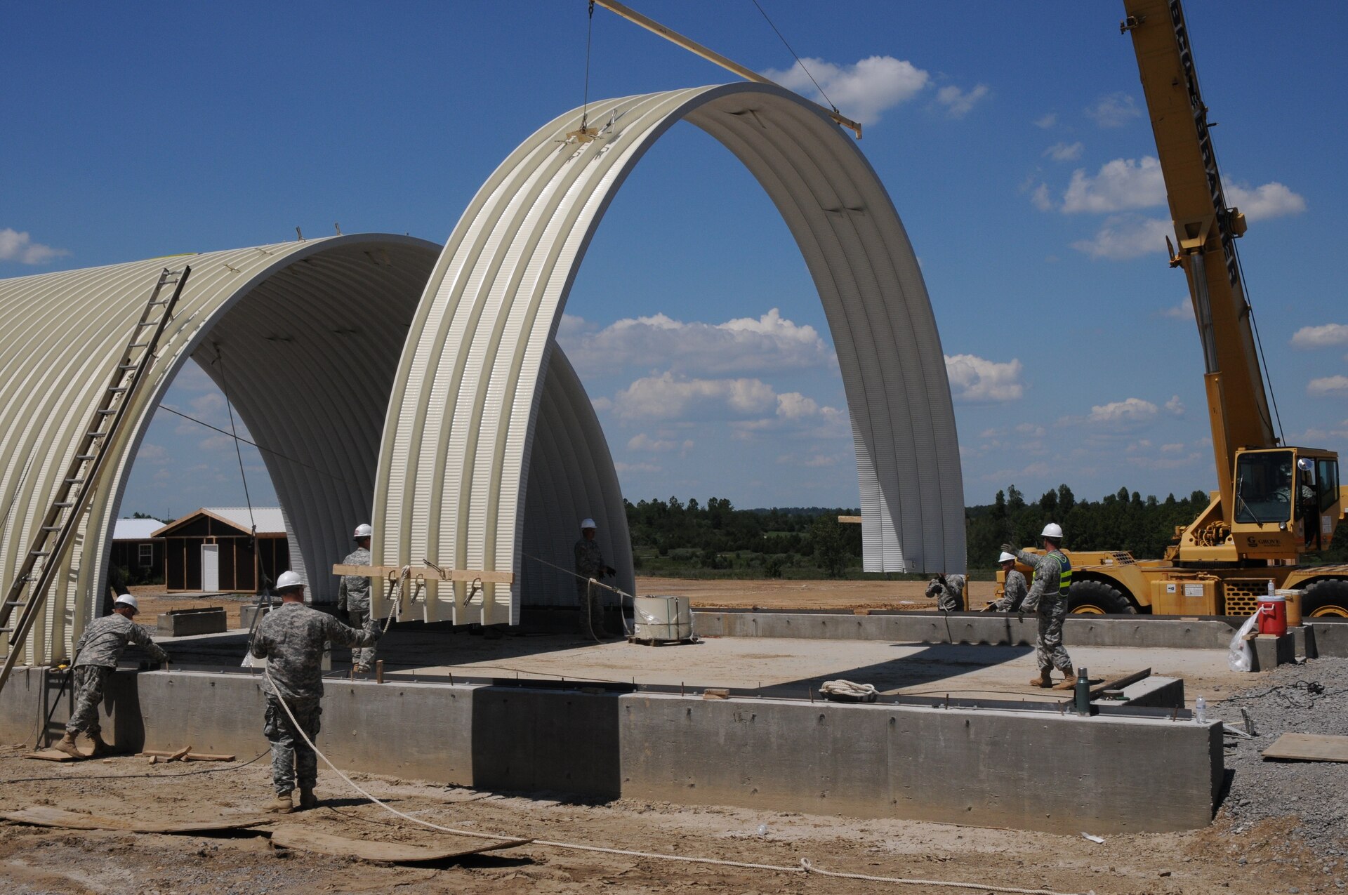Soldiers of the 149th Vertical Engineer Company construct a K-span building, as part of a training course at Wendell H. Ford Regional Training Center in Greenville, Ky., Aug. 20, 2012.