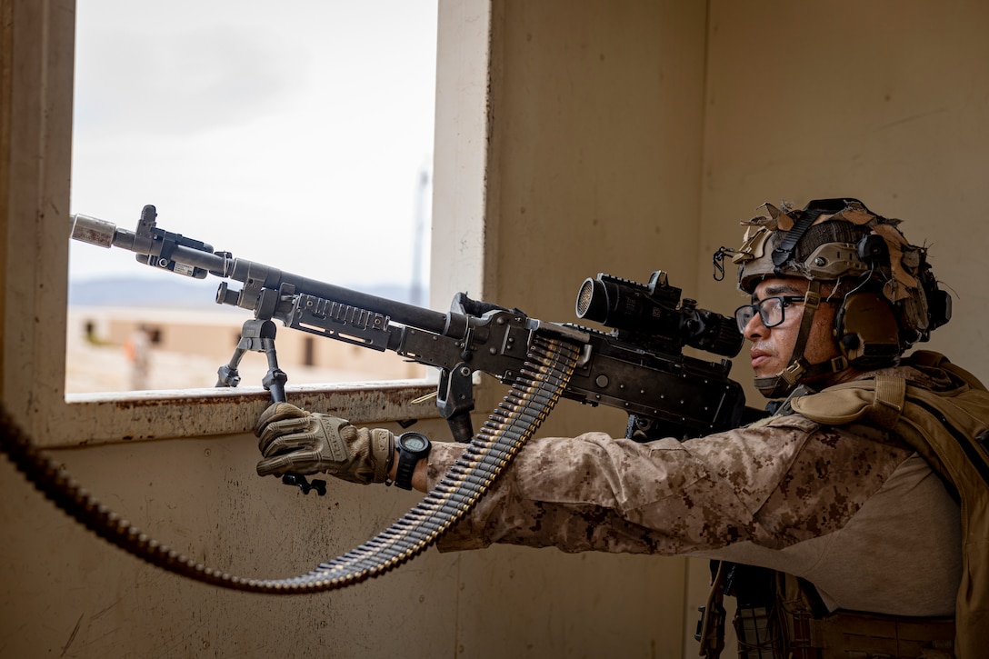 U.S. Marine Corps Lance Cpl. Adrian Rodriguez, a Bakersfield, California native, an infantry Marine with 3rd Battalion, 5th Marine Regiment, 1st Marine Division, provides suppressive fire during an Adversary Force Exercise as part of Service Level Training Exercise 5-24 at Range 220, Marine Corps Air-Ground Combat Center, Twentynine Palms, California, Aug. 1, 2024. As the Marine Corps continues to modernize and train Marines in the utilization of emerging technologies, they are given the opportunity to test, implement, and counter near-peer adversary threats. SLTE 5-24 is purpose built to train, develop, and validate the Infantry Battalion Experiment as part of a larger Marine Air-Ground Task Force operation as a Stand-in Force across a contested multi-domain distributed environment. (U.S. Marine Corps photo by Lance Cpl. Enge You)