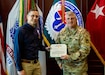 Chris Lanik, 2023 Robertson J. Short LAR of the Year, receives a Department of the Army Meritorious Civilian Service Medal June 27 from then-Commander of the Aviation and Missile Command, Maj. Gen. Tom O’Connor, at AMCOM headquarters on Redstone Arsenal, Ala.