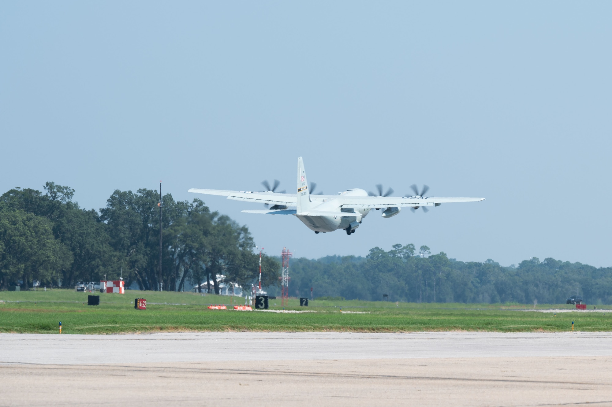 A WC-130J takes off from the flightline