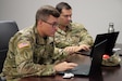 Army Reserve Maj. Matthew Fletcher, data scientist, Mountain View Battalion, Army Applications Group, 75th USARIC and who works as a data scientist in his civilian career, left, and Army Reserve 1st Lt. Joseph Yassin, cloud engineer, Support Group, 75th USARIC and who works as a senior cloud solution architect in his civilian capacity, participate in Code-A-Thon 24, as part of the 75th USARIC’s AAG and SG Artificial Intelligence Team, Aug. 1, 2024 at Fort Liberty, North Carolina in support of the XVIII Airborne Corps