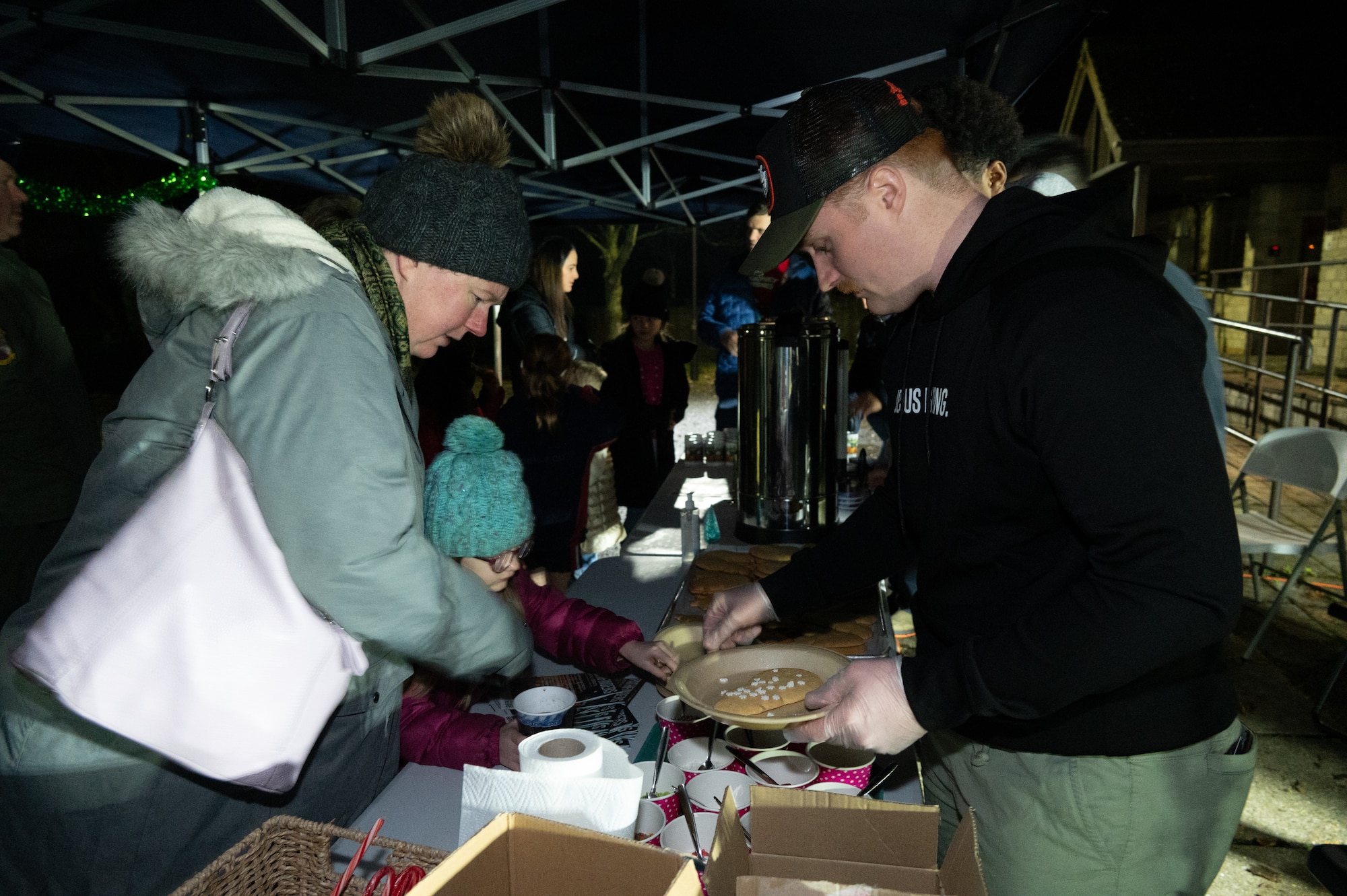 U.S. Air Force Airman 1st Class Christian Armour, 420th security forces squadron response force leader, decorates cookies