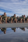New U.S. Marines with Golf Company, 2nd Recruit Training Battalion, conduct dynamic warm-ups prior to the company motivational run at Marine Corps Recruit Depot San Diego, California, Nov. 25, 2024. The company motivational run is a three-mile cadence run conducted around the Depot, the last physical training event the Marines will conduct before they graduate from MCRD San Diego and the first time their friends and families will see their newly transformed U.S. Marines. (U.S. Marine Corps photo by Cpl. Alexandra M. Earl)