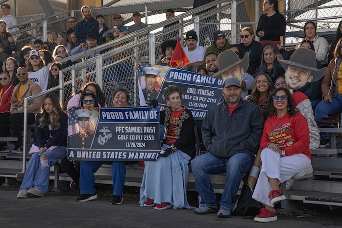 Friends and families of Golf Company, 2nd Recruit Training Battalion, wait for their new Marines to participate in the company motivational run at Marine Corps Recruit Depot San Diego, California, Nov. 25, 2024. The company motivational run is a three-mile cadence run conducted around the Depot, the last physical training event the Marines will conduct before they graduate from MCRD San Diego and the first time their friends and families will see their newly transformed U.S. Marines. (U.S. Marine Corps photo by Cpl. Alexandra M. Earl)