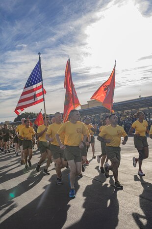 The U.S. Marines with Recruit Training Regiment, lead the company motivational run for Golf Company, 2nd Recruit Training Battalion, at Marine Corps Recruit Depot San Diego, California, Nov. 25, 2024. The company motivational run is a three-mile cadence run conducted around the Depot, the last physical training event the Marines will conduct before they graduate from MCRD San Diego and the first time their friends and families will see their newly transformed U.S. Marines. (U.S. Marine Corps photo by Cpl. Alexandra M. Earl)