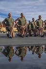 New U.S. Marines with Golf Company, 2nd Recruit Training Battalion, conduct dynamic warm-ups prior to the company motivational run at Marine Corps Recruit Depot San Diego, California, Nov. 25, 2024. The company motivational run is a three-mile cadence run conducted around the Depot, the last physical training event the Marines will conduct before they graduate from MCRD San Diego and the first time their friends and families will see their newly transformed U.S. Marines. (U.S. Marine Corps photo by Cpl. Alexandra M. Earl)