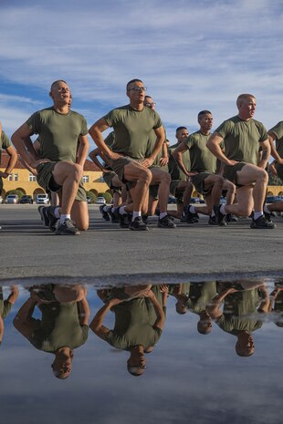New U.S. Marines with Golf Company, 2nd Recruit Training Battalion, conduct dynamic warm-ups prior to the company motivational run at Marine Corps Recruit Depot San Diego, California, Nov. 25, 2024. The company motivational run is a three-mile cadence run conducted around the Depot, the last physical training event the Marines will conduct before they graduate from MCRD San Diego and the first time their friends and families will see their newly transformed U.S. Marines. (U.S. Marine Corps photo by Cpl. Alexandra M. Earl)