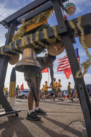 A new U.S. Marine with Golf Company, 2nd Recruit Training Battalion, rings a liberty bell during the company motivational run at Marine Corps Recruit Depot San Diego, California, Nov. 25, 2024. The company motivational run is a three-mile cadence run conducted around the Depot, the last physical training event the Marines will conduct before they graduate from MCRD San Diego and the first time their friends and families will see their newly transformed U.S. Marines. (U.S. Marine Corps photo by Cpl. Alexandra M. Earl)
