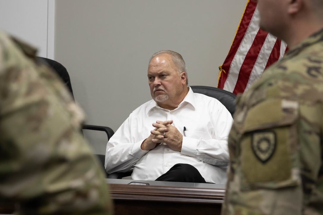 Nelson County Judge Executive Tim Hutchins listens to a presentation in Bardstown, Nov. 19. Members of the Kentucky National Guard County Outreach Team speak to Nelson County Emergency Management and elected officials about emergency planning and to identify any shortfalls in resources where the Guard can assist. (U.S. Army National Guard Photo by Milt Spalding)