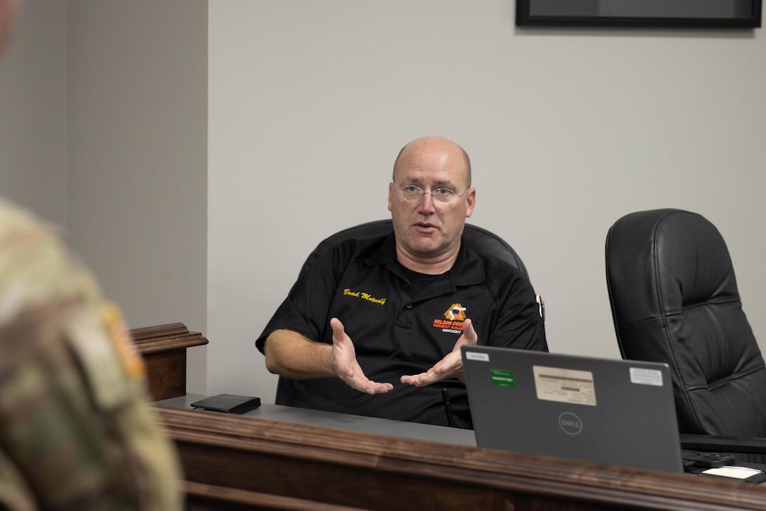 Nelson County Emergency Management Director Brad Metcalf talks about some recent security upgrades made by the county at a meeting in Bardstown, Nov. 19. Members of the Kentucky National Guard County Outreach Team speak to Nelson County Emergency Management and elected officials about emergency planning and to identify any shortfalls in resources where the Guard can assist. (U.S. Army National Guard Photo by Milt Spalding)