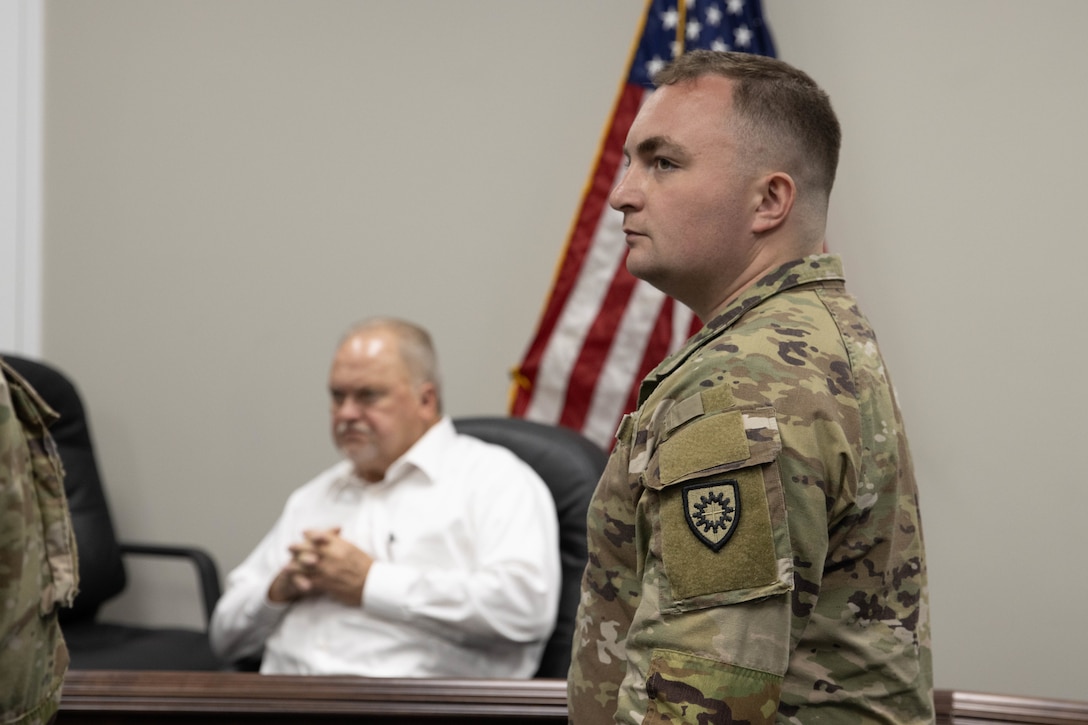 1st Lt. Jadon Douglas listens during a presentation in Bardstown, Nov. 19. Members of the Kentucky National Guard County Outreach Team speak to Nelson County Emergency Management and elected officials about emergency planning and to identify any shortfalls in resources where the Guard can assist. (U.S. Army National Guard Photo by Milt Spalding)