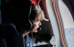 U.S. Coast Guard Capt. Tina Pena, chief of staff of the Seventh District, assesses the damage in western Florida caused by Hurricane Ian from an HC-144 airplane, Oct. 1, 2022. Crews in the air and on the ground continue to conduct search and rescue, damage assessment, and pollution assessment.
(U.S. Coast Guard photo by Petty Officer 2nd Class Ronald Hodges)