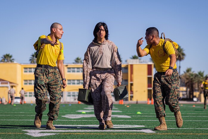 U.S. Marine Corps Recruit Serriah Poleviyuma with Echo Company, 2nd Recruit Training Battalion, conducts maneuver under fire drill during an introduction to a combat fitness training event at Marine Corps Recruit Depot San Diego, California, Nov. 13, 2024. The CFT is an annual fitness test that is required of all Marines to pass and maintain consisting of an 880-yard sprint, ammunition can lifts, and a maneuver under fire drill. (U.S. Marine Corps photo by Lance Cpl. Eric Valerio)