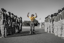 U.S. Marine Corps Sgt. Takiyah Wesley, a drill instructor with Echo Company, 2nd Recruit Training Battalion, instructs recruits during an introduction to a combat fitness training event at Marine Corps Recruit Depot San Diego, California, Nov. 13, 2024. The CFT is an annual fitness test that is required of all Marines to pass and maintain consisting of an 880-yard sprint, ammunition can lifts, and a maneuver under fire drill. (U.S. Marine Corps photo illustration by Lance Cpl. Eric Valerio)