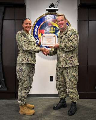 Hospital Corpsman 2nd Class Jocelyne Palacios-Martinez poses for an awards photo during her graduation from the Aviation Physiologist Technician course at the Naval Aerospace Medical Institute (NAMI), Aug. 22. Students of the course now receive transferrable college credit through the Uniformed Services University and their College of Allied Health Sciences. The Navy Medicine Operational Training Command (NMOTC) is the Navy’s leader in operational medicine and trains specialty providers for aviation, surface, submarine, expeditionary, and special operations communities. With five detachments, 12 training centers, and facilities in over 60 locations across the United States, NMOTC provides high impact individual medical training for the Navy, other U.S. armed forces, and allied nations around the globe. (U.S. Navy photo by Mass Communication Specialist 1st Class Russell Lindsey SW/AW)