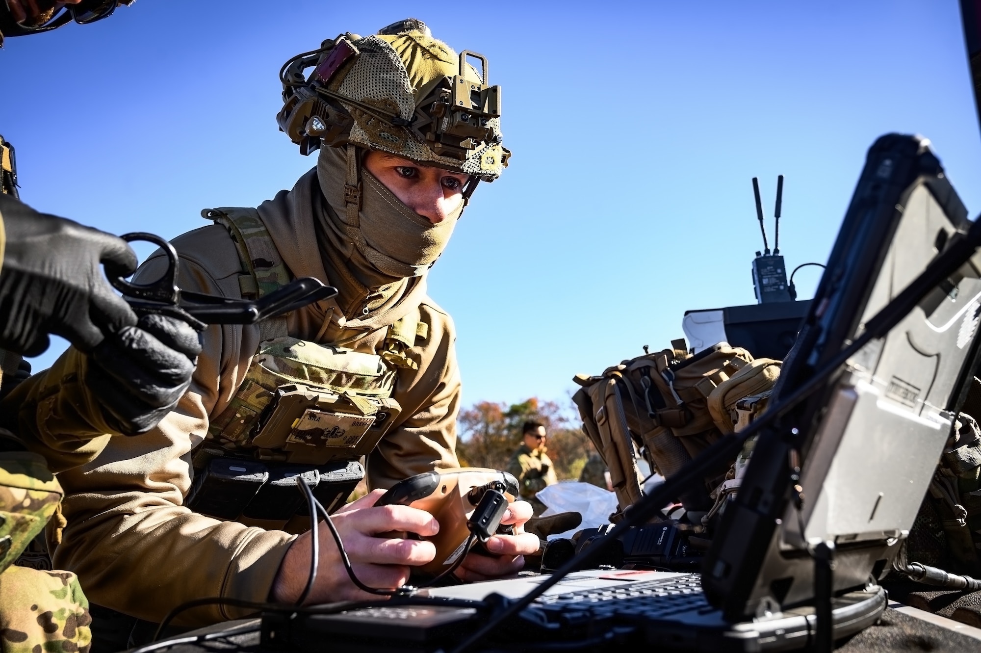 U.S. Air Force Senior Airman Carson Gregg, 87th Civil Engineer Squadron explosive ordnance disposal technician, operates a man transportable robotics system at Joint Base McGuire-Dix-Lakehurst, N.J., Nov. 13, 2024. The 87th CES EOD unit underwent a four-day training involving three teams of three technicians who worked through 20 intricate scenarios as part of an annual training qualification. (U.S. Air Force photo by Senior Airman Matt Porter)