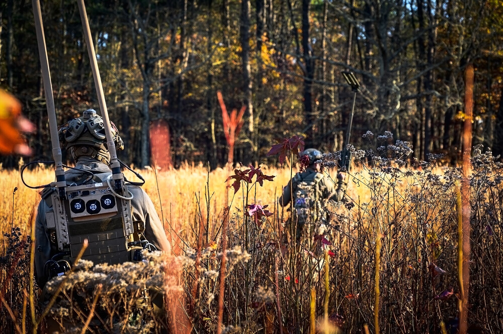 U.S. Air Force Senior Airman Nicholas Izzo, 87th Civil Engineer Squadron explosive ordnance disposal technician, and Staff Sgt. Justin Sommer, 87th Civil Engineer Squadron EOD technician, perform a sweep at Joint Base McGuire-Dix-Lakehurst, N.J., Nov. 13, 2024. The 87th CES Explosive Ordnance Disposal unit underwent a four-day training involving three teams of three technicians who worked through 20 intricate scenarios as part of an annual training qualification. (U.S. Air Force photo by Senior Airman Matt Porter)